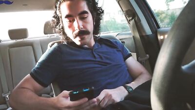 Mustache bloke plays with his big prick inside the car