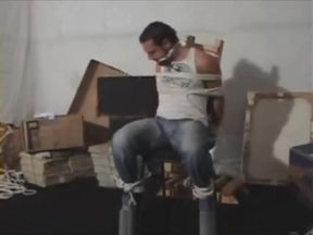 Mark Legnaro tied up and cleave gagged in tight jeans to a chair otm gagged