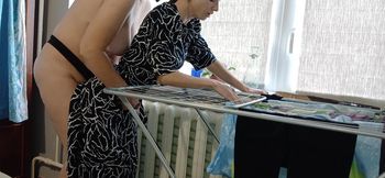 I caught one of my neighbors hanging out her laundry while another neighbor was fucking her with a strapon