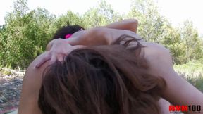 Two brunettes are fisting each other