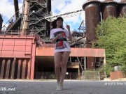 Jeny Smith is walking naked through an abandoned factory.