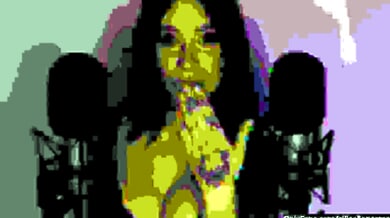 Tattooed MILF Ellie Alien performs intimate ASMR with kiss sounds and whispers into dual mics