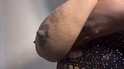 Large breasts of an ebony Black Latina woman