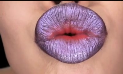 Beautiful Japanese babe with juicy lips poses on camera