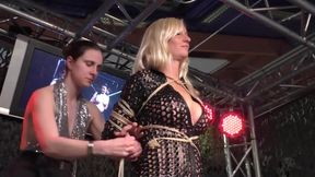 Blond Girl Tied Live On Stage