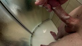 Fitness young guy is masturbating in the shower after gym