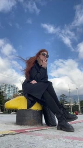 smoke redhead in street