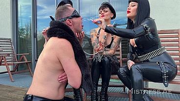 Smoking on the Patio - MistressAe and Friends Share Their Human Ashtray
