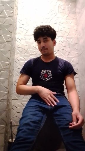 Indian Handsome Boy While His Hard Penis Is Erect and He Strokes His Hand Again in the Toilet Video