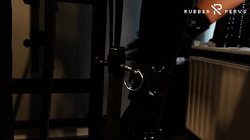 Rubberslut with Heavy Rubber Helmet fucking her pussy on slave chair
