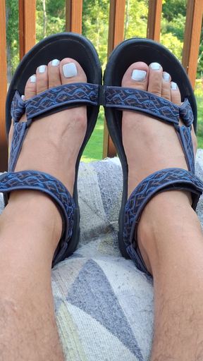 Showing off my painted white toes in strappy Teva sandals