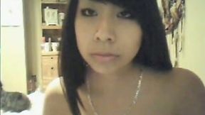 Attractive Asian babe shows me her small and perky tits on webcam