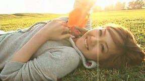 Cheerful Japanese teen Revive goofs around in the field wearing bikini