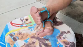 Showing off her cute barefoot sandals on her cute bare feet