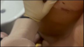 Miss Nastya surprises her slave by giving him a gloved blowjob and handjob while he's drying himself up