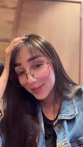 Woman with glasses and hair tie