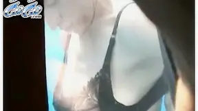 Sporty chick in black panties is washing her hairy pussy