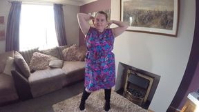 Wife doing striptease in apron and boots