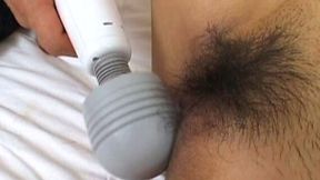 Squeaky Japanese slut teased with a Hitachi toy on the bed