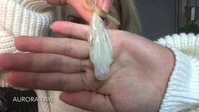 blonde slut plays with used condoms and cum