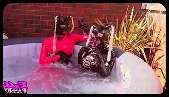Sensual Latex Lesbians Enjoy Steamy Hot Tub Fun