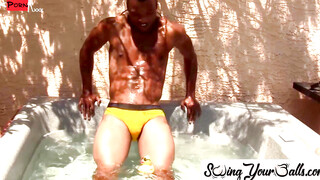 SwingYourBalls.com - Gay jock tugs his thick black cock and balls solo in the pool