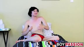 Twink tugs on his massive cock and uses dildo on his ass