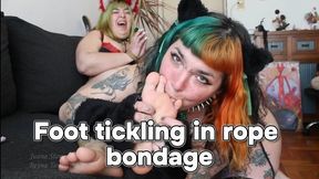 Foot tickling in rope bondage