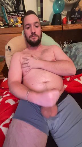 Chubby boy jerks off in bed