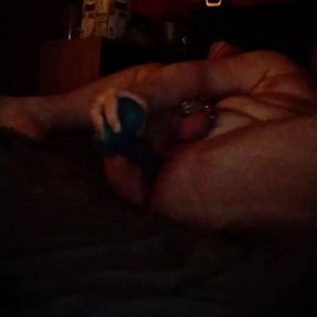 Solo fun with dildo in chastity cage