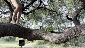 Showing off my rainbow sandals in a tree