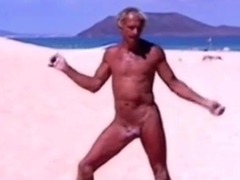 Tanned guy on beach in tiny string thong (temporarily!)