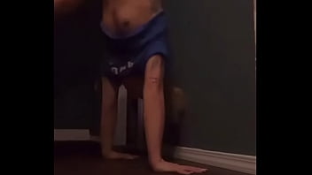 Teen doing a handstand and has nip slip