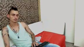 Skinny Tatted Studio Performer Typing to His Viewers