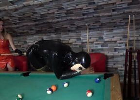 Latex crossdresser gets fucked by domina with a billiard stick