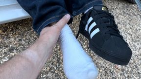 Stranger massages my feet and removes my sneakers and socks