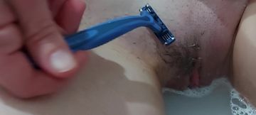 Shaving hairy pussy. Close-up!