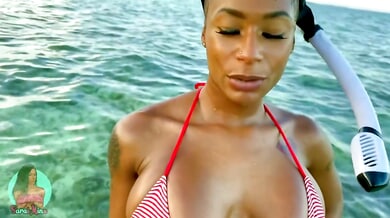 Sarai Minx gets intimate with a white diver during a tropical snorkeling trip