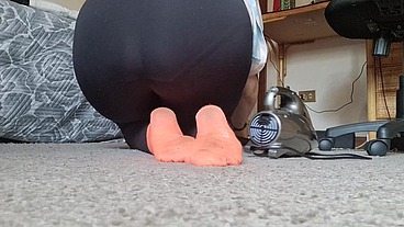 Italian housewife vacuums carpet
