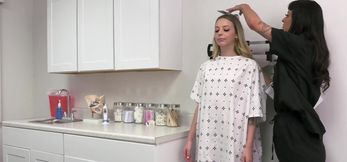 Nurse Charlie Valentine prepares the patient Lily