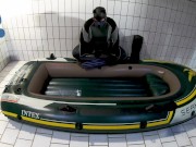 Wetsuit, Fins and Boat - geared pup pawing off