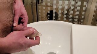 Urinating inwards a used love glove