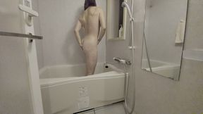 asian mature woman takes a shower