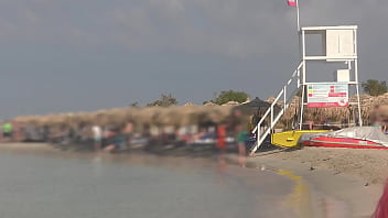 Pissing among people on the beach