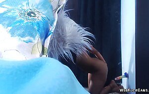 Ebony fucks dildo stuck to the wall on webcam