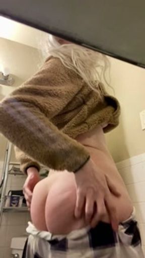All natural blonde playing with herself in a bathroom