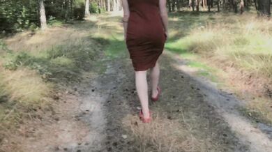 Ginger pissing outdoors flashing big boobs under the trees