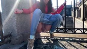 Sexy girl wets in a public spot