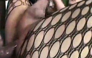 Tranny in fishnet lingerie eats an artist