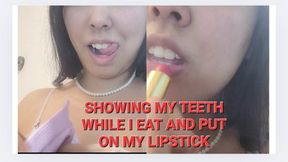 SHOWING TEETH , EATING AND PUT LIPSTICK